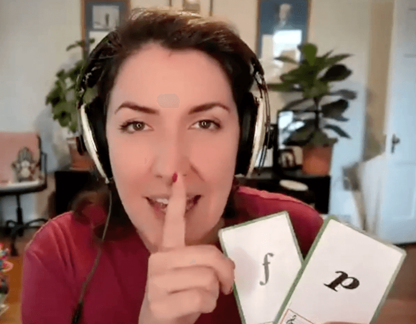 photo of jen holding a card for piano and forte during an online event